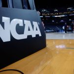 Judge delays NCAA settlement that would allow athlete revenue sharing